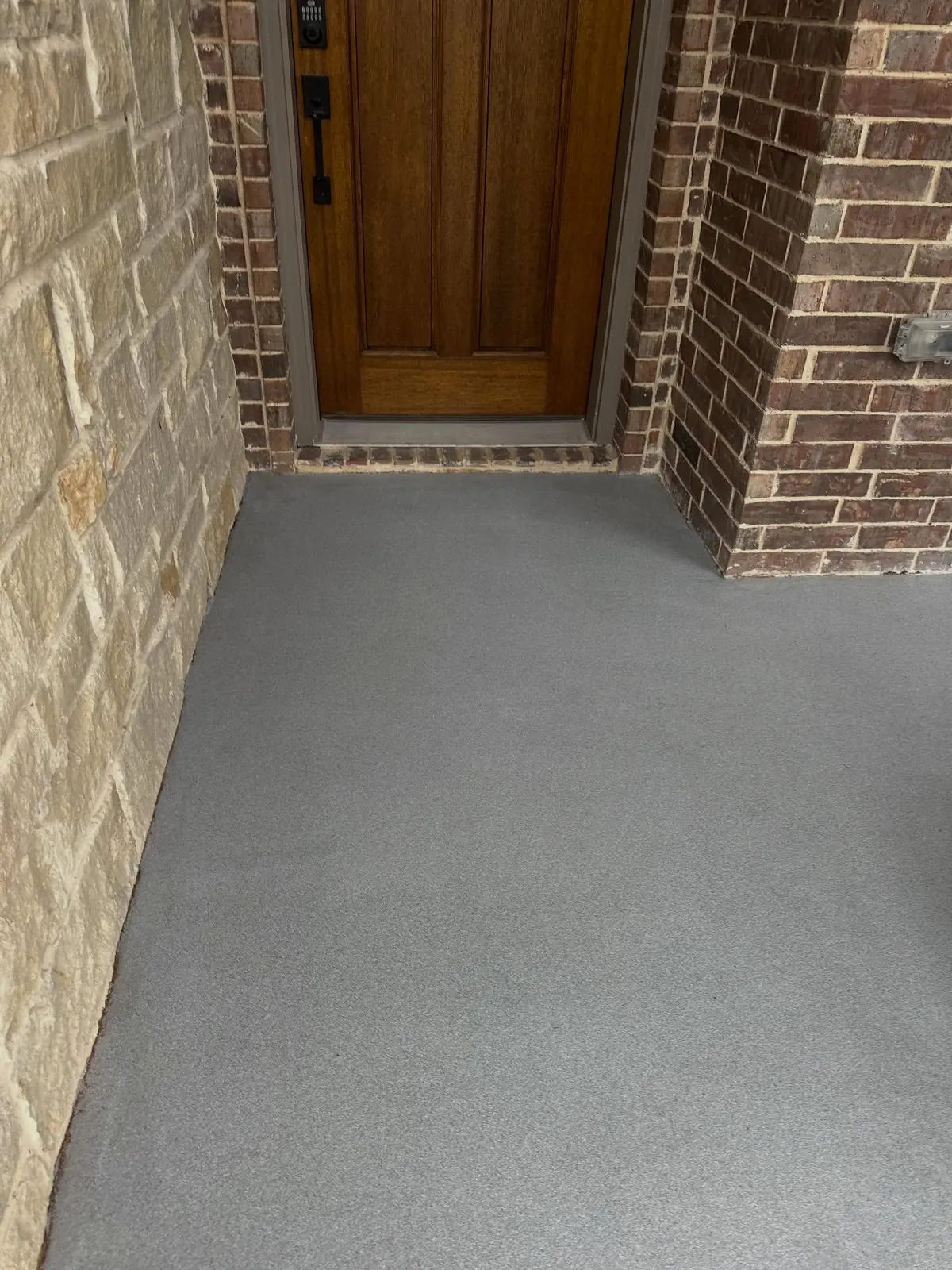 Front entry with new gray flake resin floor coating in Arlington, TX