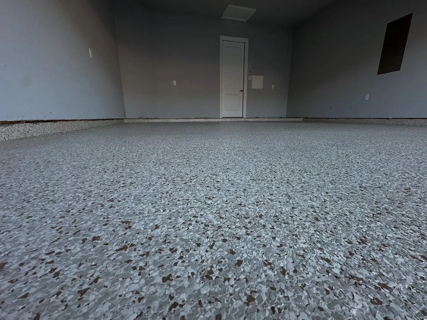 Finished full-flake garage floor coating in an Arlington, TX home