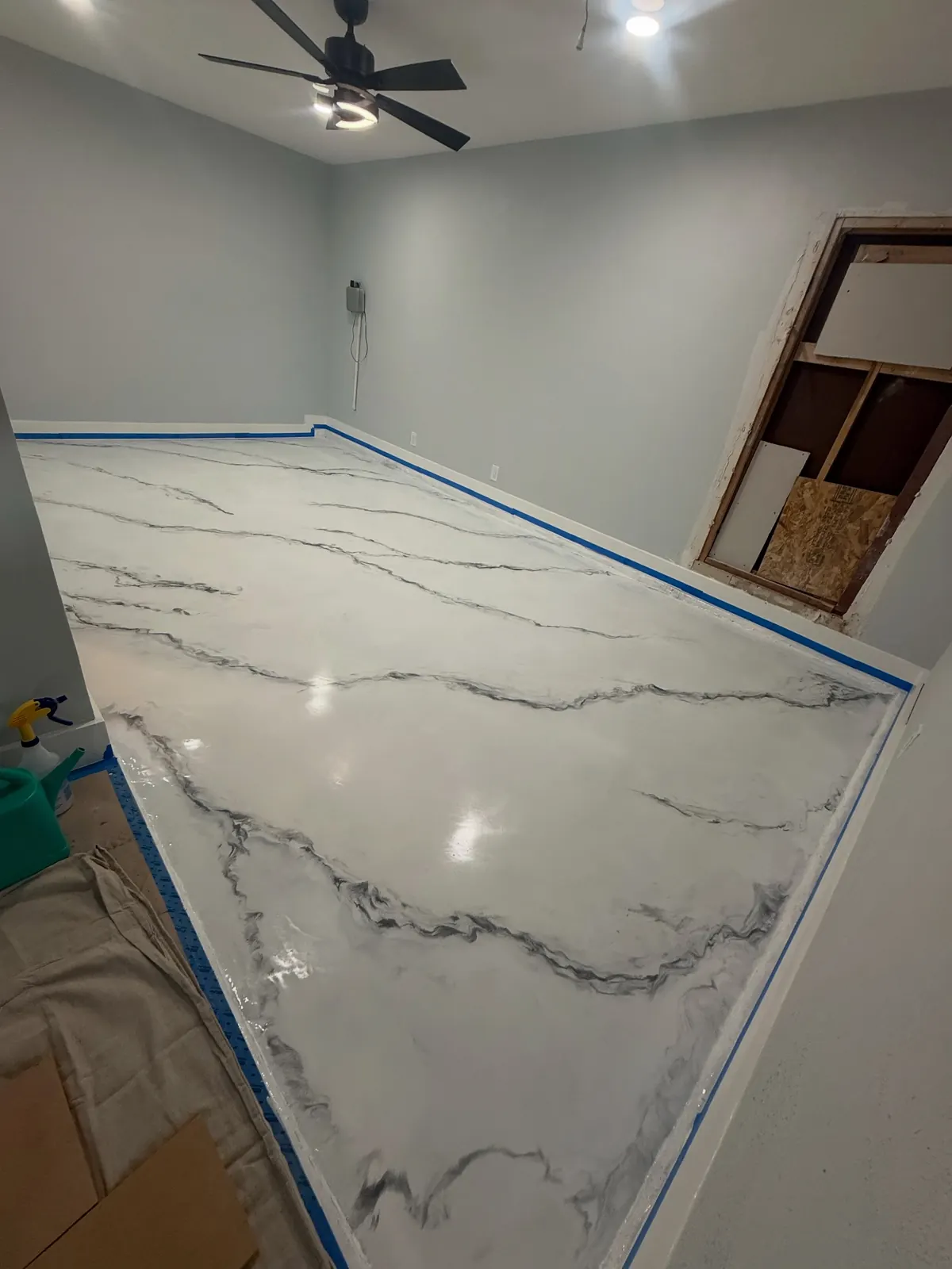 White metallic marble epoxy floor with gray veining in a large room